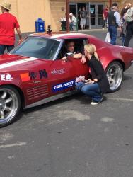 Photo of Mike & Brianne Maier talking business and race strategy at Goodguys Pleasanton 